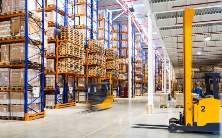 Large warehouse with stacked pallets.