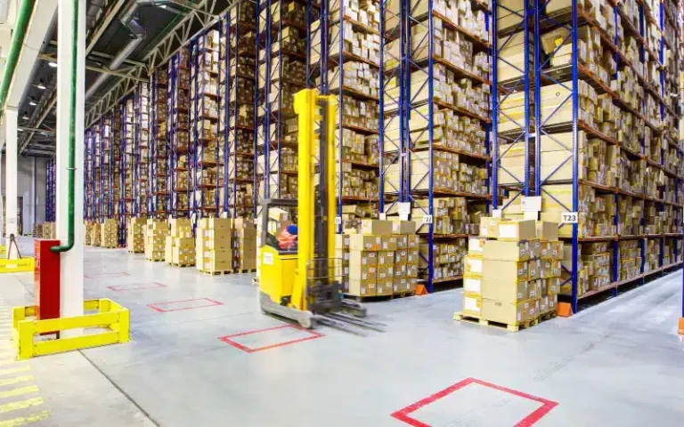 Warehouse with stacked boxes and forklift