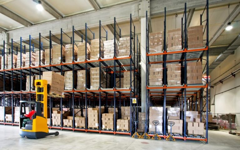 Warehouse filled with stacked cardboard boxes