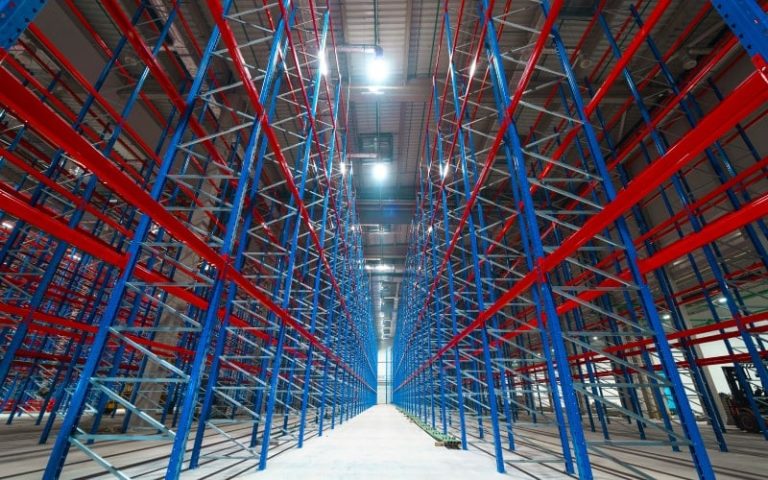 Empty warehouse with colorful shelving units