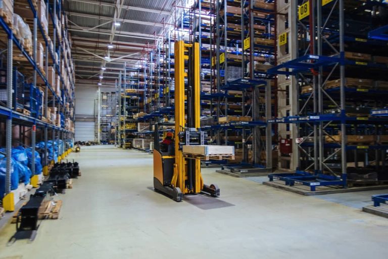 Forklift in a warehouse aisle