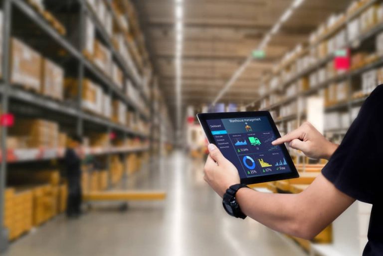 Person using tablet in warehouse