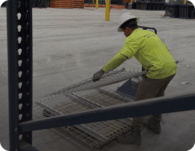 Worker organizing metal rebar on site