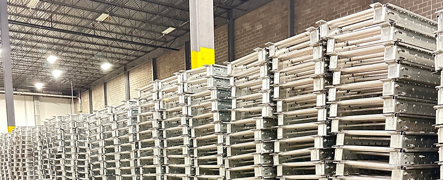Stacked metal storage racks in warehouse