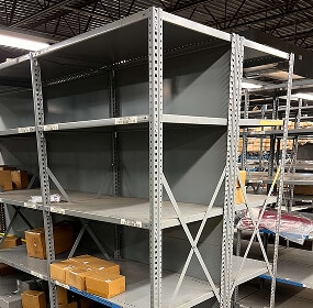 Empty metal shelving unit in warehouse