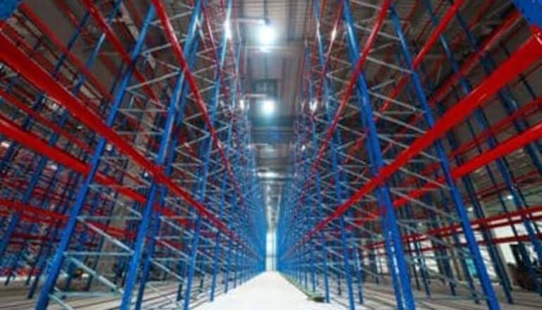 Empty warehouse with blue-red shelving