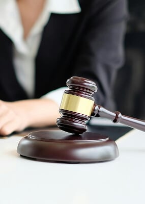 Gavel on a table, legal setting