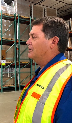 Man in safety vest in warehouse