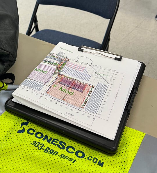 Clipboard with construction site plans