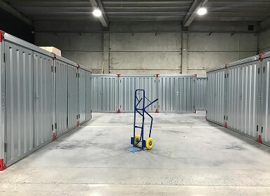 Empty storage units with hand truck.