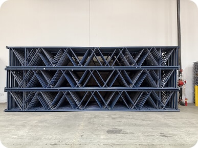 Stacked metal frames in warehouse