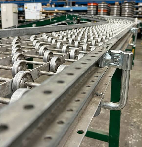 Metal conveyor system with rollers