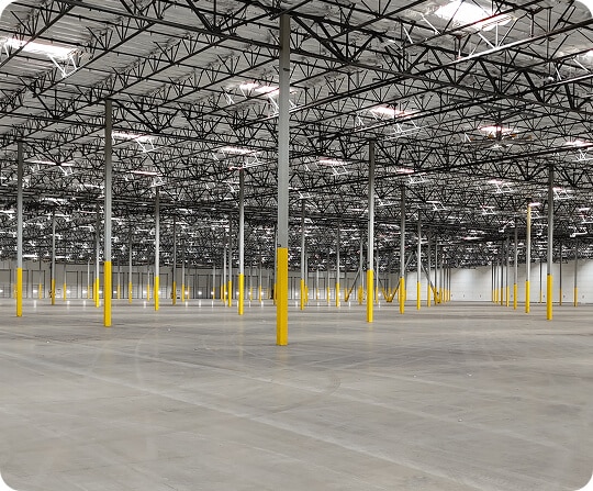 Empty warehouse with yellow support columns