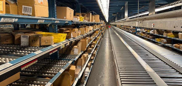 Warehouse shelves filled with packages.