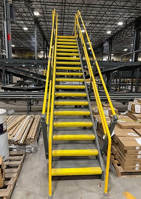 Yellow safety stairs in warehouse