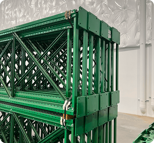 Stacked green metal storage racks