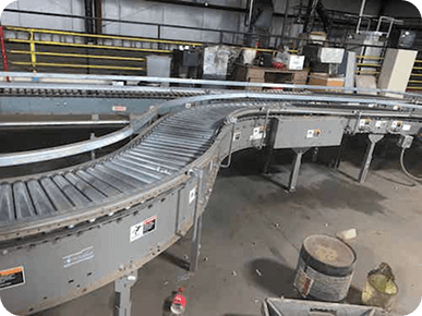 Curved conveyor belt in warehouse