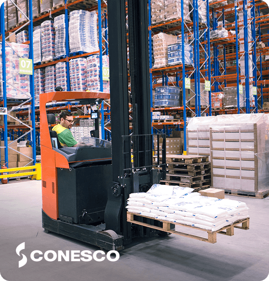 Forklift transporting pallets in warehouse