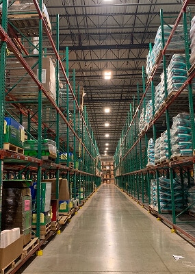 Aisle between tall storage shelves