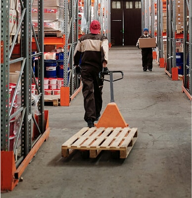 Warehouse workers moving goods