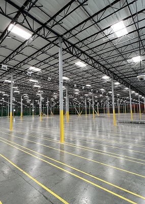 Large empty warehouse with yellow lines