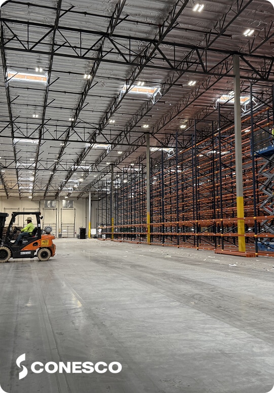 Empty warehouse with shelving units