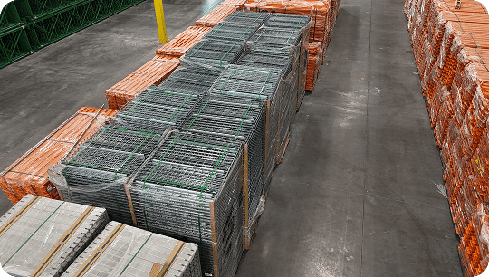 Stacks of metal and orange pallets