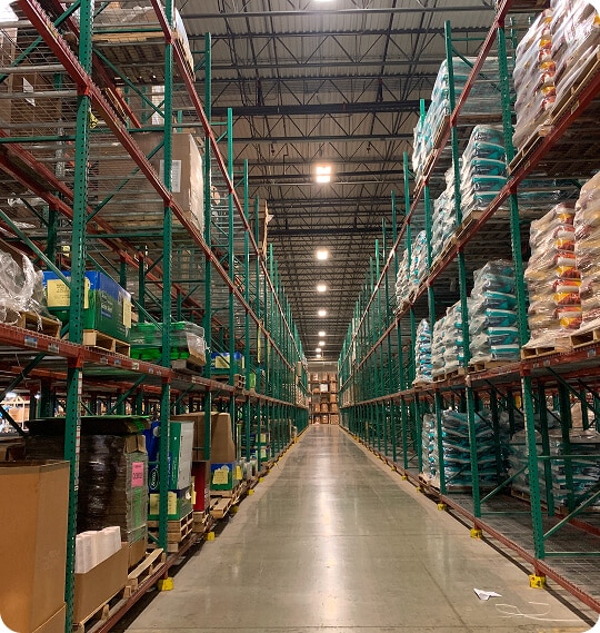 Aisle between tall storage shelves.