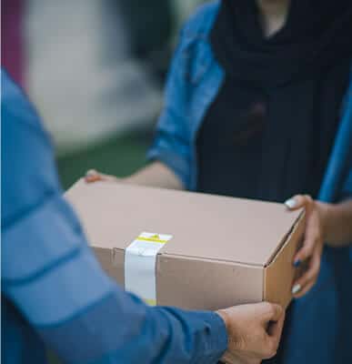 Person receiving a packaged delivery.