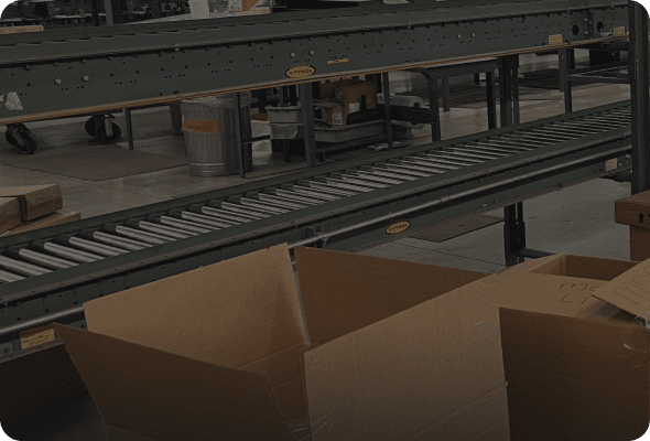 Conveyor belt with empty cardboard boxes