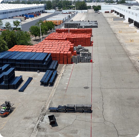 Warehouse with stacked shipping containers