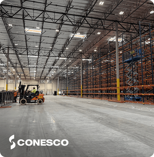 Large warehouse with forklift and shelves