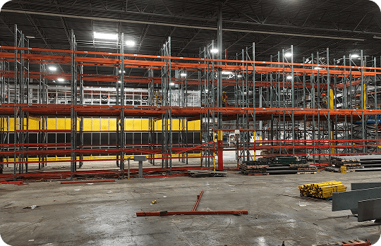 Empty warehouse with metal shelving units