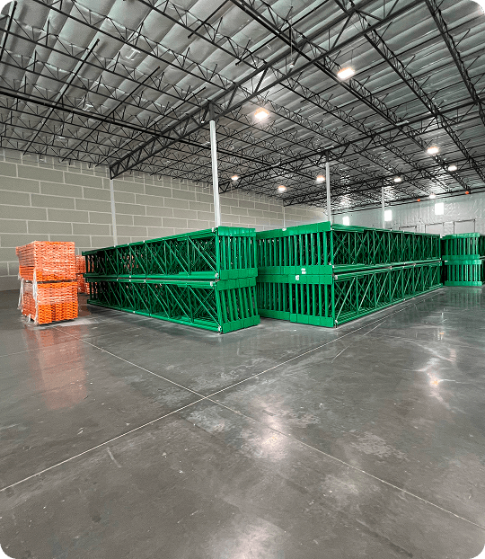 Green pallet racks in warehouse