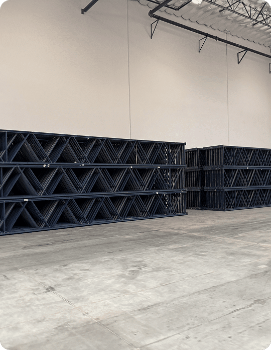 Empty warehouse with stacked shelving units