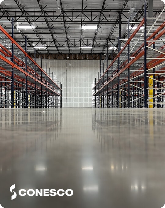 Empty warehouse with metal shelving units