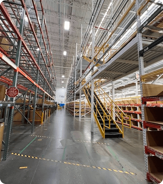 Warehouse with shelving and stairs