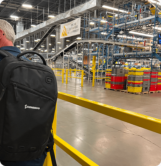 Warehouse with person and backpack visible