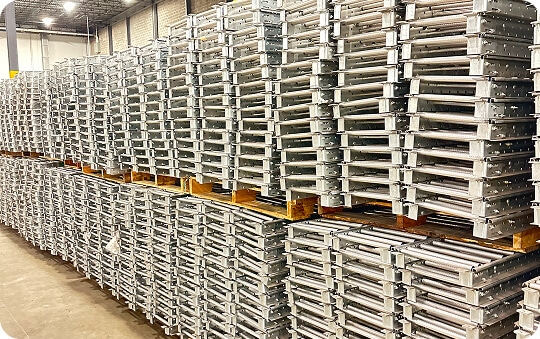 Stacked metal pallets in warehouse