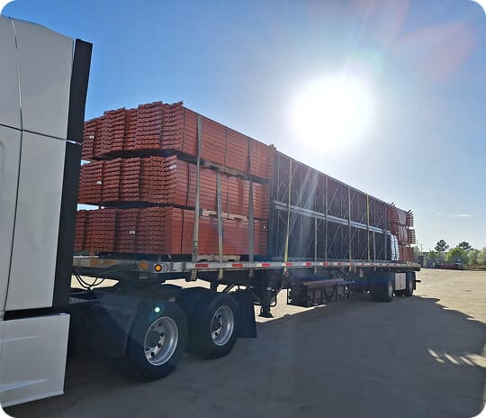 Truck loaded with stacked equipment crates