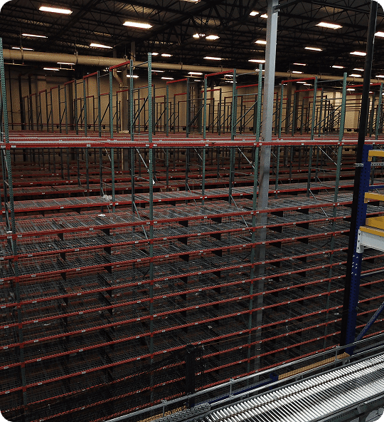 Warehouse shelving with empty racks.