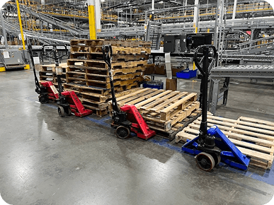 Pallets and hand trucks in warehouse