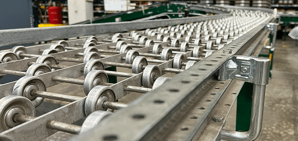 Metal conveyor system with rollers